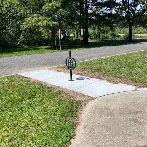 fleur de lis pole in pavement